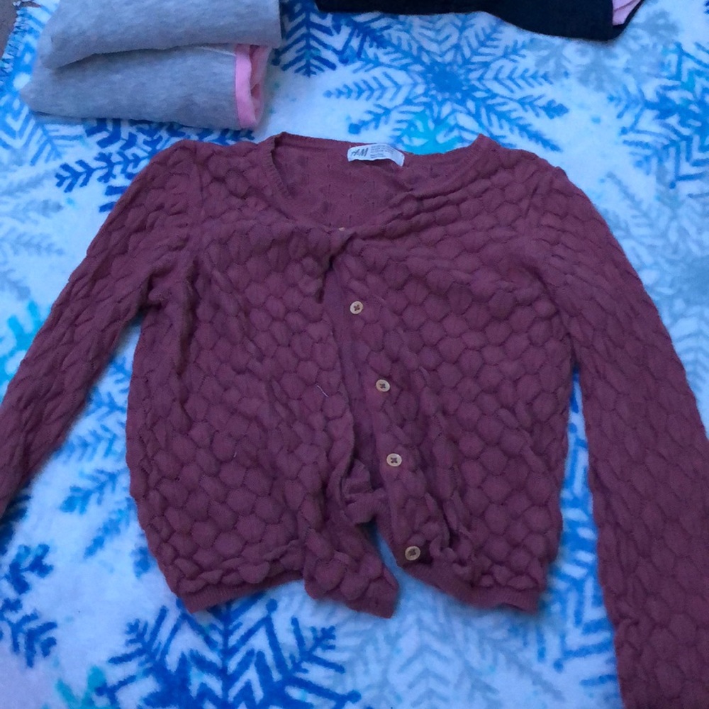 A pink button up cardigan
